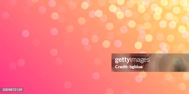 defocused lights on orange background - trendy bokeh background - orange glitter stock illustrations
