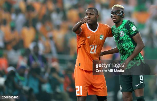 Evan Ndicka of Ivory Coast competes with Victor Osimhen of Nigeria ,during the TotalEnergies CAF Africa Cup of Nations final match between Nigeria...