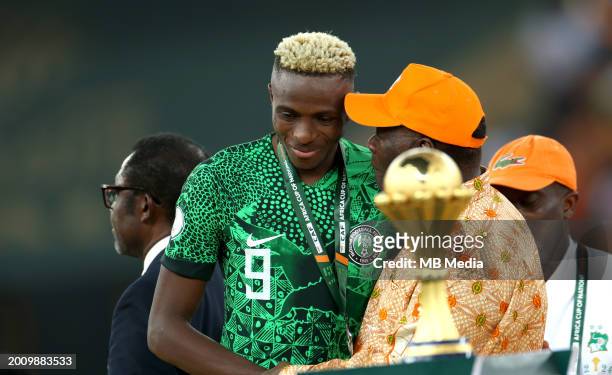 Nigeria's forward Victor Osimhen speaks with President of Ivory Coast Alassane Ouattara at the end of the Africa Cup of Nations 2024 final football...