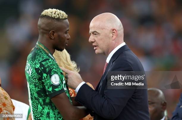 Nigeria's forward Victor Osimhen greets President of FIFA Gianni Infantino at the end of the Africa Cup of Nations 2024 final football match between...