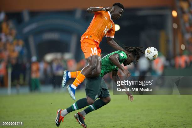 Oumar Diakite of Ivory Coast competes for the ball with Calvin Bassey of Nigeria ,during the TotalEnergies CAF Africa Cup of Nations final match...