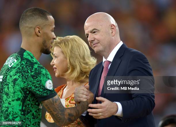 Nigeria's defender William Troost-Ekong greets President of FIFA Gianni Infantino at the end of the Africa Cup of Nations 2024 final football match...
