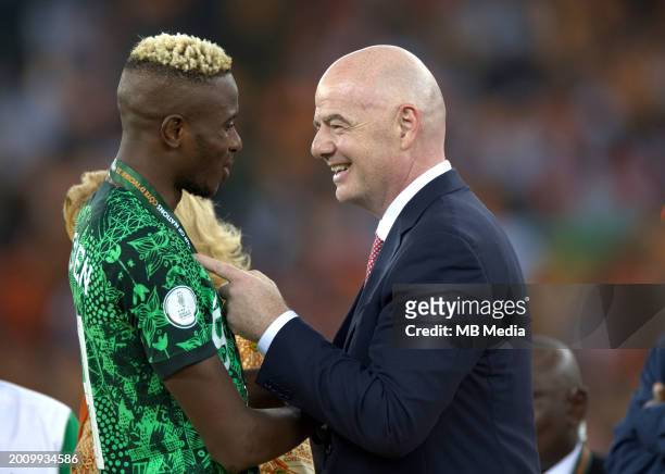 Nigeria's forward Victor Osimhen greets President of FIFA Gianni Infantino at the end of the Africa Cup of Nations 2024 final football match between...