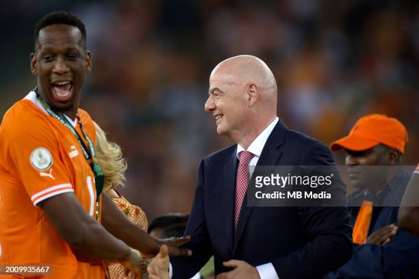 Willy Boly of Ivory Coast greets President of FIFA Gianni Infantino at the end of the Africa Cup of Nations 2024 final football match between Nigeria...
