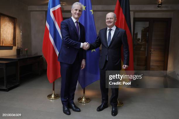 German Chancellor Olaf Scholz and Norwegian Prime Minister Jonas Gahrn Store shake hands as they pose for the media during bilateral talks at the...