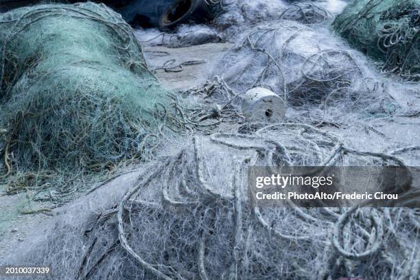 neglected fishing nets - nautische ausrüstung stock-fotos und bilder