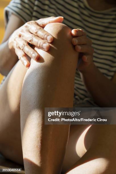 unidentified person's hands touching their legs - pursuit sports competition format stock pictures, royalty-free photos & images