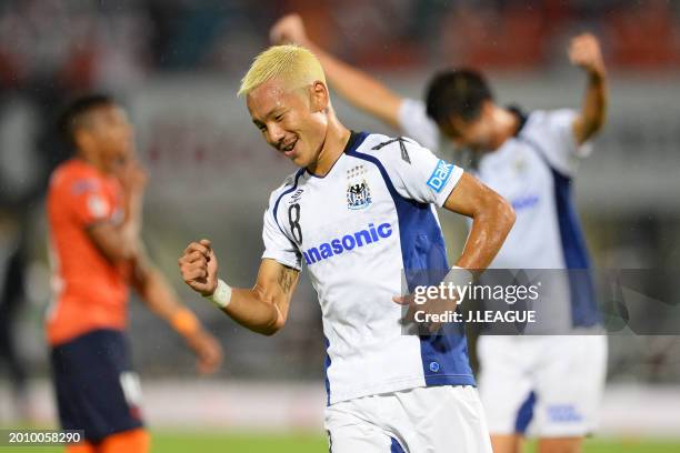 Yosuke Ideguchi of Gamba Osaka celebrates after scoring the team's first goal during the J.League J1 match between Omiya Ardija and Gamba Osaka at...