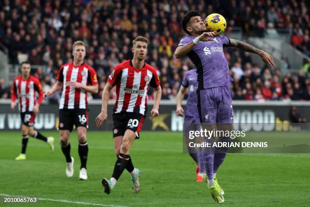 Liverpool's Colombian midfielder Luis Diaz struggles to control the ball during the English Premier League football match between Brentford and...