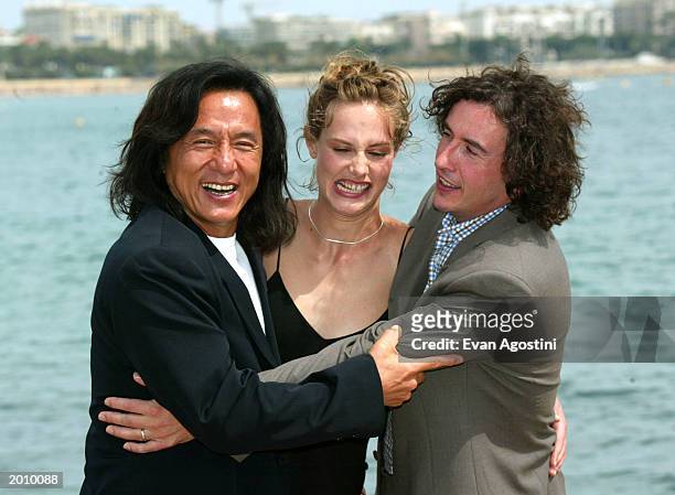 Actors Jackie Chan, Cecile de France, Steve Coogan pose during the photocall for "Around the World in 80 Days" at the Majestic Pier during 56th...