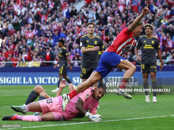 Atletico Madrid's Spanish midfielder Marcos Llorente celebrates scoring the opening goal during the Spanish league football match between Club...