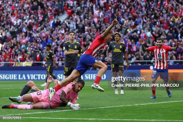 Atletico Madrid's Spanish midfielder Marcos Llorente celebrates scoring the opening goal during the Spanish league football match between Club...