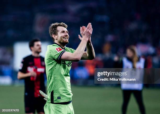 Goalkeeper Lukas Hradecky of Leverkusen celebrates the victory with the fans during the Bundesliga match between Bayer 04 Leverkusen and FC Bayern...