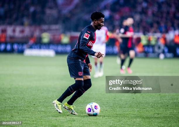 Amine Adli of Leverkusen runs with the ball during the Bundesliga match between Bayer 04 Leverkusen and FC Bayern Muenchen at BayArena on February...