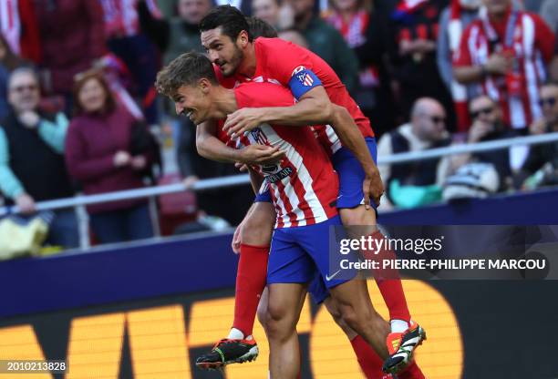 Atletico Madrid's Spanish midfielder Marcos Llorente celebrates scoring the second goal, with Atletico Madrid's Spanish midfielder Koke, during the...
