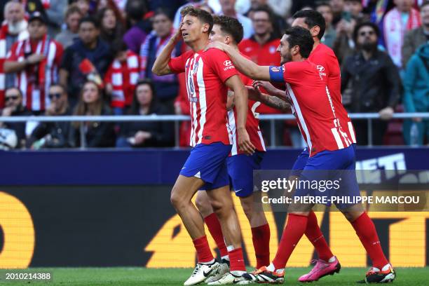 Atletico Madrid's Spanish midfielder Marcos Llorente celebrates scoring the second goal during the Spanish league football match between Club...