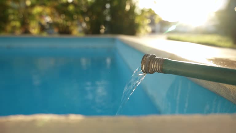 https://media.gettyimages.com/id/2010244069/video/close-up-stream-of-water-flowing-from-a-green-hose-and-filling-a-clean-blue-swimming-pool-in.jpg?b=1&s=640x640&k=20&c=w-I9VwMUq-PX1vPEKO5-XOfAMNSHwmJTnfbd2jUFKxE=