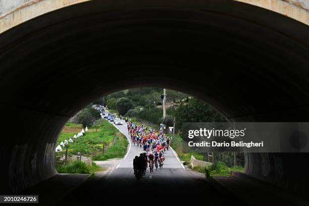 Martin Tjotta of Norway and Team Arkéa - B&B Hotels and Vito Braet of Belgium and Team Intermarché - Wanty lead the peloton passing through a...