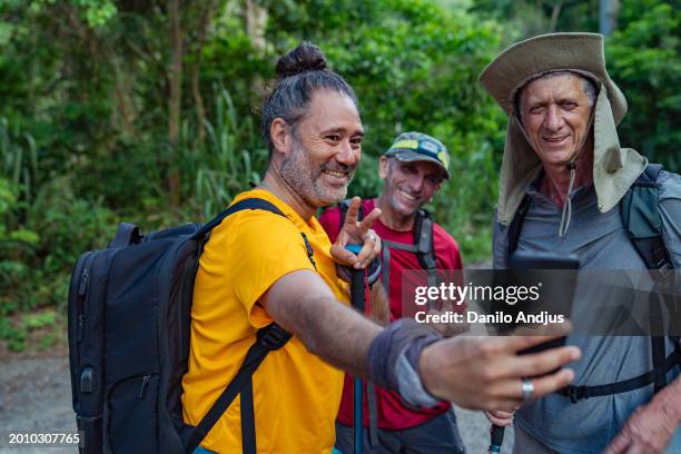 best friends have a day of adventure - backpacker phone stock pictures, royalty-free photos & images