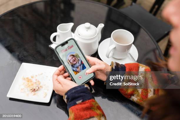 using a dating app at a cafe - food and drink icon stock pictures, royalty-free photos & images