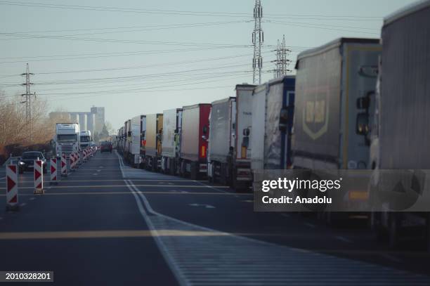 Around a thousand, mostly Ukrainian trucks wait in kilometre-long lines after Polish farmers closed off the border crossing between Poland and...