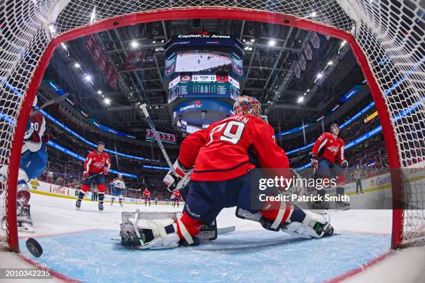 Goalie Charlie Lindgren of the Washington Capitals allows a goal against the Colorado Avalanche during the first period at Capital One Arena on...