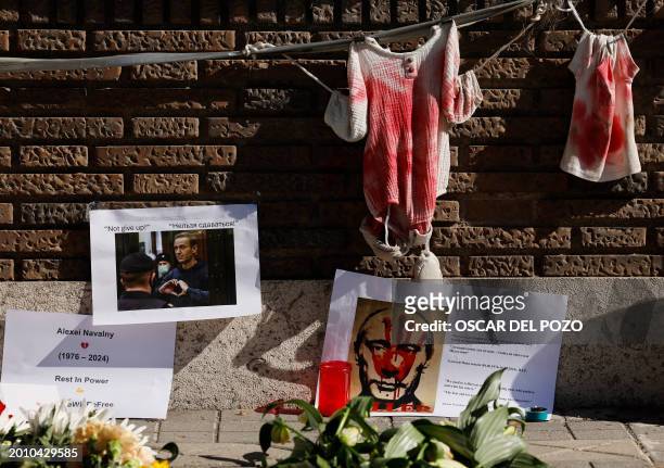 Photographs and flowers are placed in front of the Russian embassy in Madrid on February 17 one day after Russian officials announced the death of...