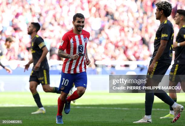 Atletico Madrid's Argentinian forward Angel Correa celebrates scoring his team's fourth goal during the Spanish league football match between Club...