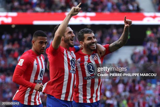 Atletico Madrid's Argentinian forward Angel Correa celebrates scoring his team's fourth goal, with Atletico Madrid's Spanish midfielder Koke and...