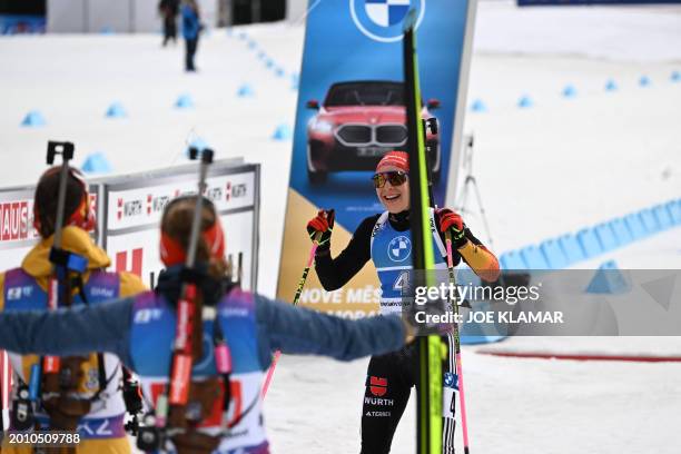 Germany's Sophia Schneider celebrates after crossing the finnish line and taking the third place in the women's 4x6km relay event of the IBU Biathlon...