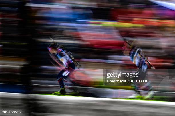 France's Justine Braisaz and Norway's Ida Lien compete during the women's 4x6km relay event of the IBU Biathlon World Championships in Nove Mesto,...