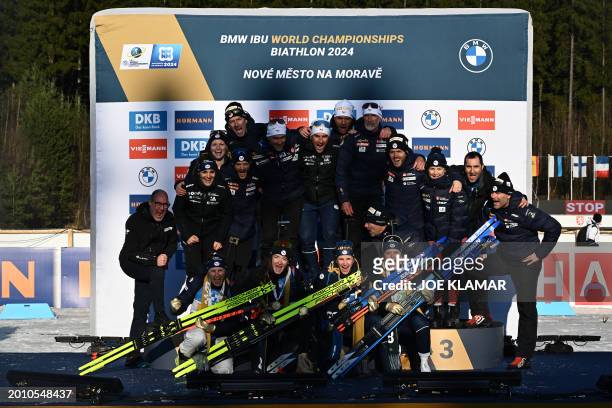 France's team celebrates on the podium after winning the women's 4x6km relay event of the IBU Biathlon World Championships in Nove Mesto, Czech...
