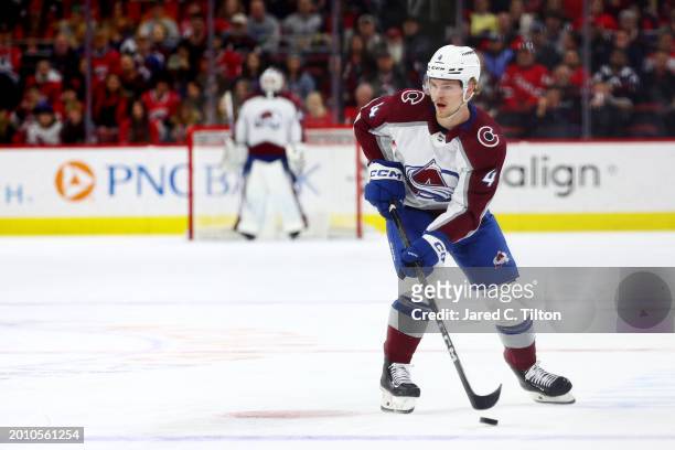 Bowen Byram of the Colorado Avalanche skates with the puck during the first period of the game against the Carolina Hurricanes at PNC Arena on...