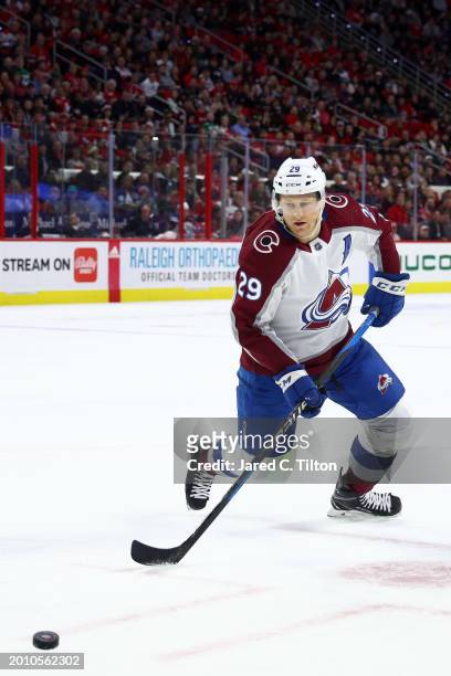 Nathan MacKinnon of the Colorado Avalanche skates with the puck during the first period of the game against the Carolina Hurricanes at PNC Arena on...