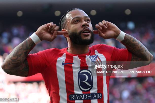 Atletico Madrid's Dutch forward Memphis Depay celebrates scoring his team's fifth goal during the Spanish league football match between Club Atletico...