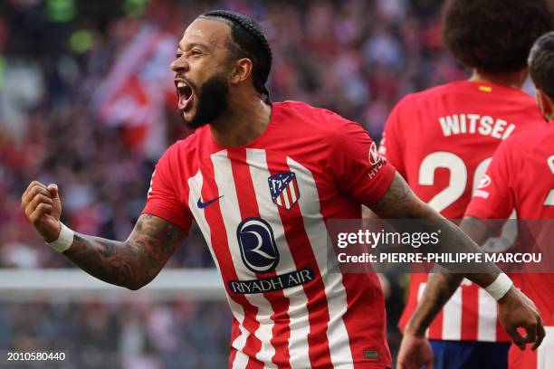 Atletico Madrid's Dutch forward Memphis Depay celebrates scoring his team's fifth goal during the Spanish league football match between Club Atletico...