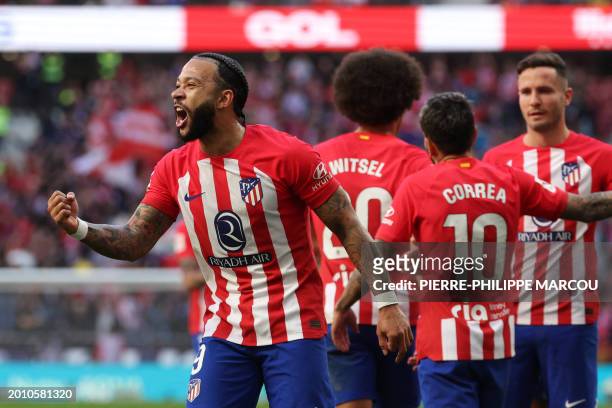 Atletico Madrid's Dutch forward Memphis Depay celebrates scoring his team's fifth goal during the Spanish league football match between Club Atletico...