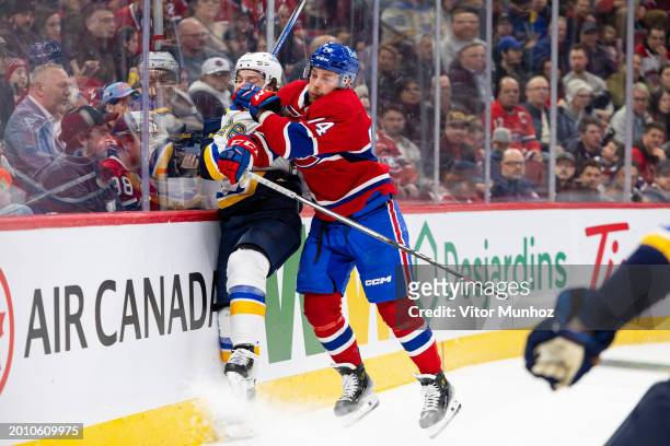 Brandon Gignac of the Montreal Canadiens hits Nathan Walker of the St. Louis Blues into the boards during the first period of the NHL regular season...