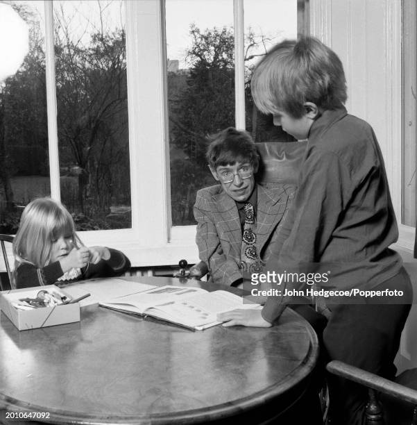 English theoretical physicist Stephen Hawking at home with his son Robert and daughter Lucy in Cambridge, England in 1978. Hawking, currently a...