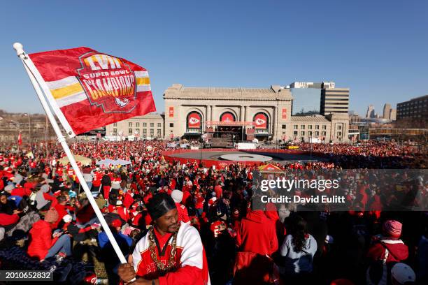 General view as Kevin Moore of Kansas City waves a flag in front of Union Station prior to the Kansas City Chiefs Super Bowl LVIII victory parade on...