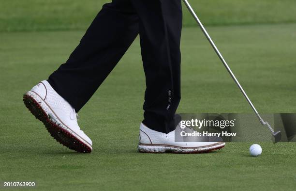 Detailed view of the shoes worn by Tiger Woods of the United States on the second green during a pro-am prior to The Genesis Invitational at Riviera...