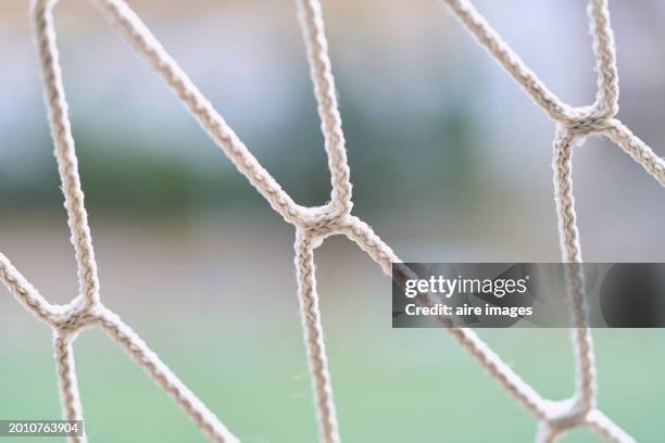 megaphone on a metal pole on a soccer field, low angle view looking towards a cloudy blue sky. - description stock pictures, royalty-free photos & images
