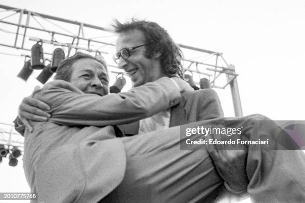 Italian actor Roberto Benigni jokes with the general secretary of the Italian Communist Party Enrico Berlinguer during an electoral rally at the...