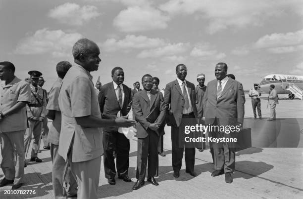 Zambian politician Kenneth Kaunda, President of Zambia, greets leading members of the United African National Council , including Zimbabwean bishop...