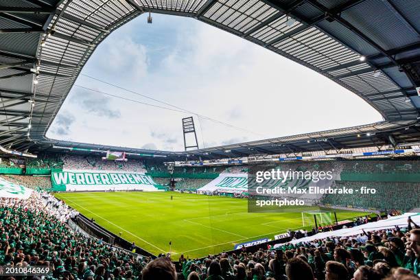 Overview of the wohninvest WESERSTADION in Bremen with a choegraphy of the fans on Werder's 125th birthday before the Bundesliga match between SV...