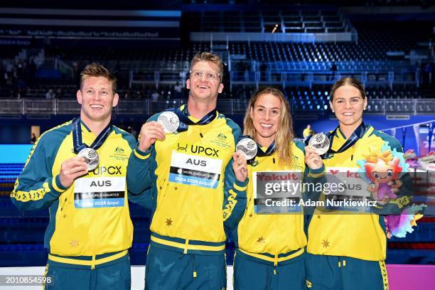 Silver Medalists, Bradley Woodward, Sam Williamson, Brianna Throssell and Shayna Jack of Team Australia celebrate on the podium after the Medal...