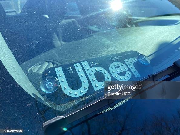 Uber Signage Uber sign in windshield of car, Queens, New York. News Photo - Getty Images