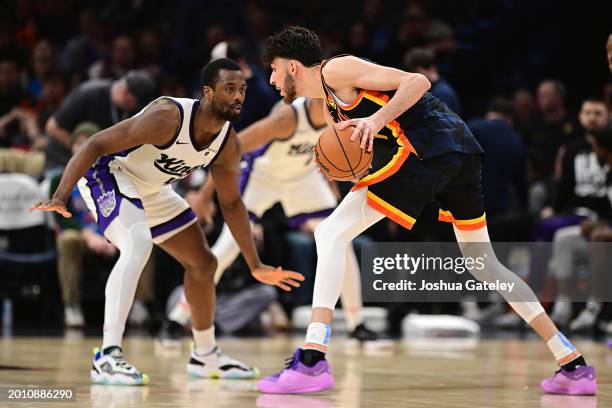 Chet Holmgren of the Oklahoma City Thunder looks to drive the ball while being defended by Harrison Barnes of the Sacramento Kings during the second...