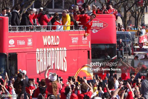 Patrick Mahomes of the Kansas City Chiefs catches a football during the Kansas City Chiefs Super Bowl LVIII victory parade on February 14, 2024 in...