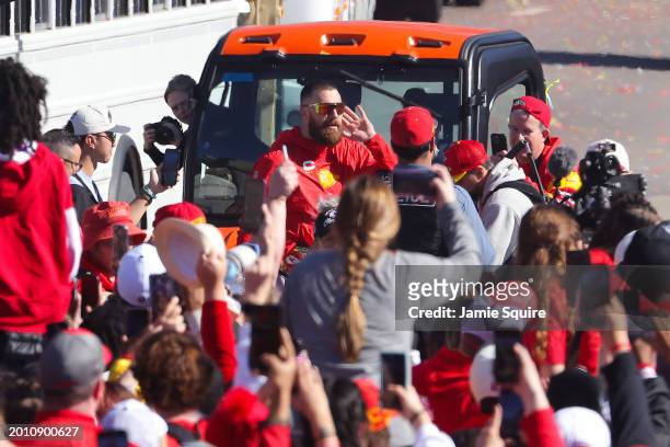 Travis Kelce of the Kansas City Chiefs celebrates with fans during the Kansas City Chiefs Super Bowl LVIII victory parade on February 14, 2024 in...